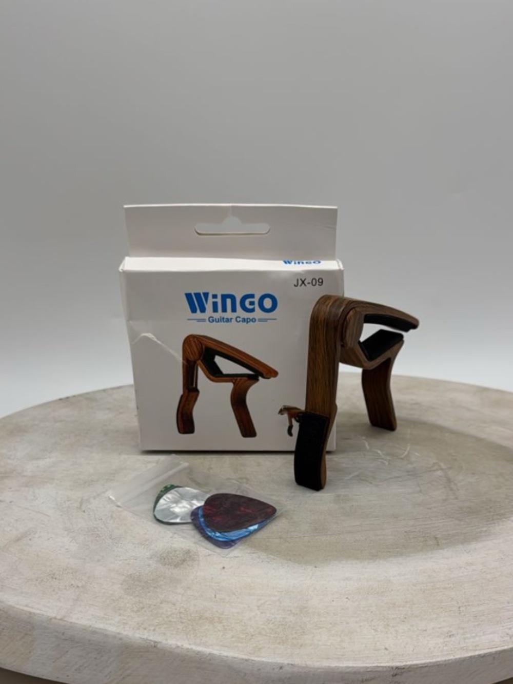 Winco JX-09 Guitar Capo Wood Grain Pattern Finish Brand New With Picks